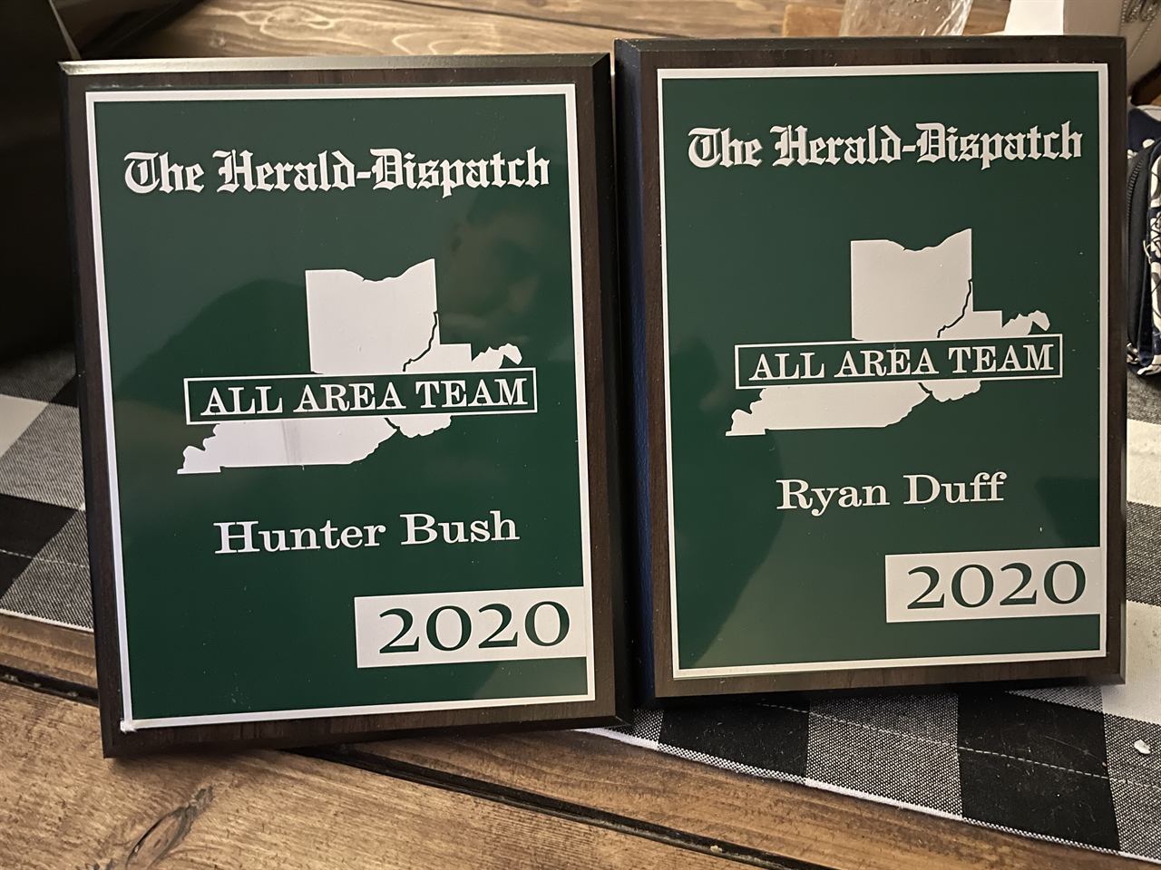 Green Herald-Dispatch All Area Team 2020 recognition plaques for Hunter Bush and Ryan Duff