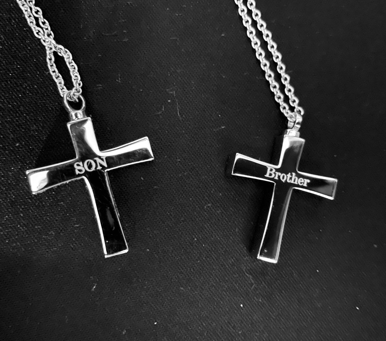 Two stainless cross keepsake pendants engraved Son and Brother