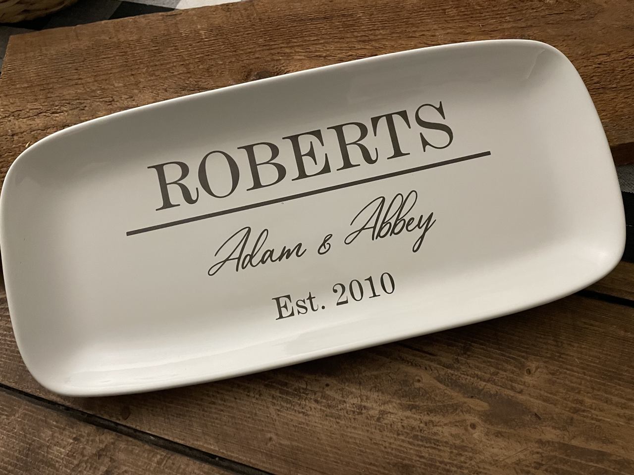 White ceramic platter engraved Roberts, Adam and Abbey, Est. 2010